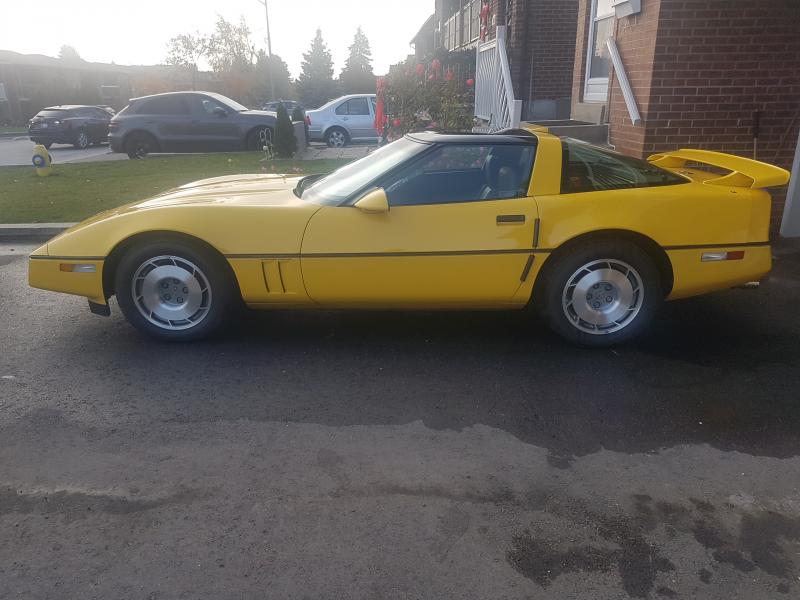 1987 yellow Chevy Corvette Coupe